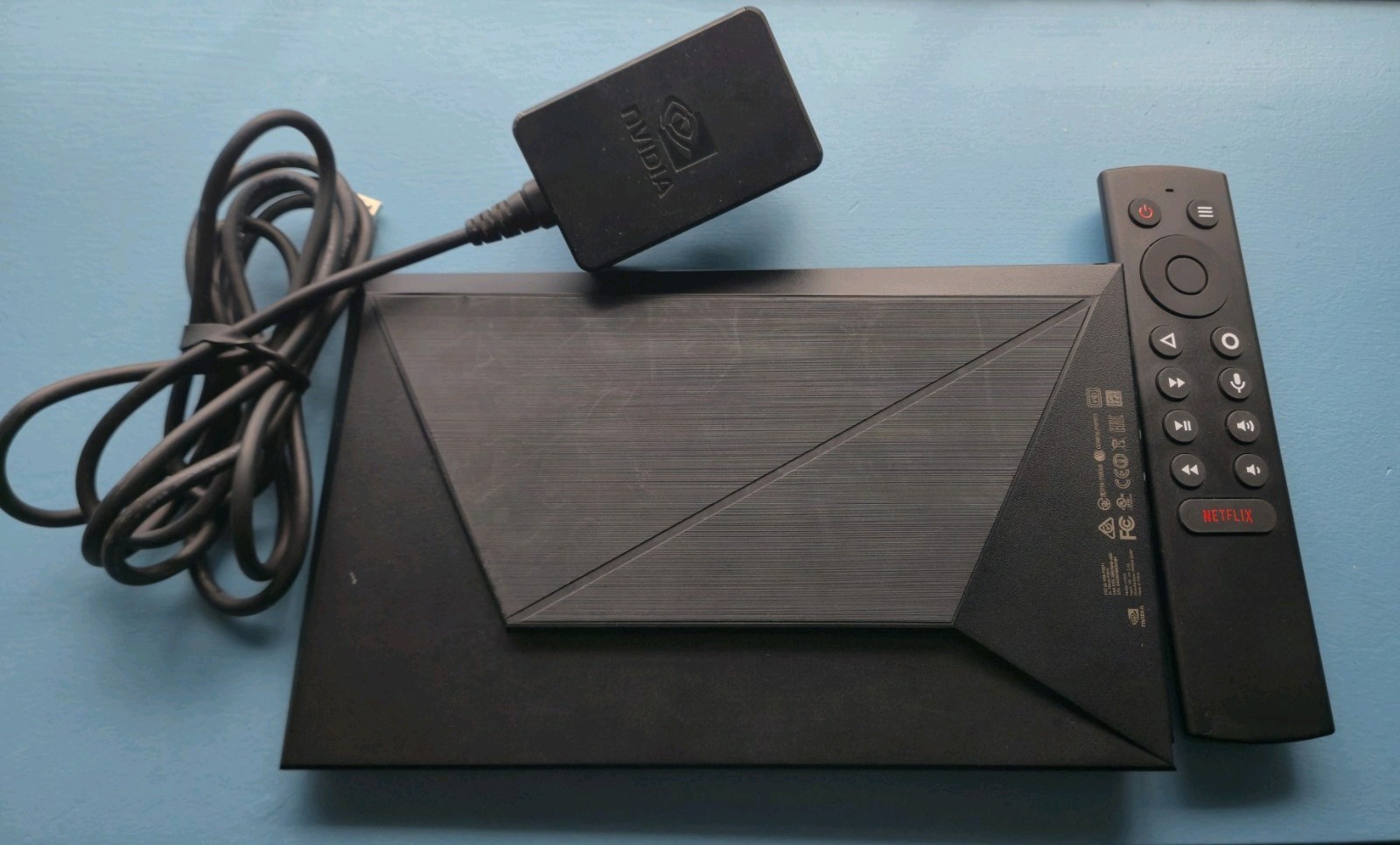 NVIDIA Shield TV 2015 with power adapter and remote