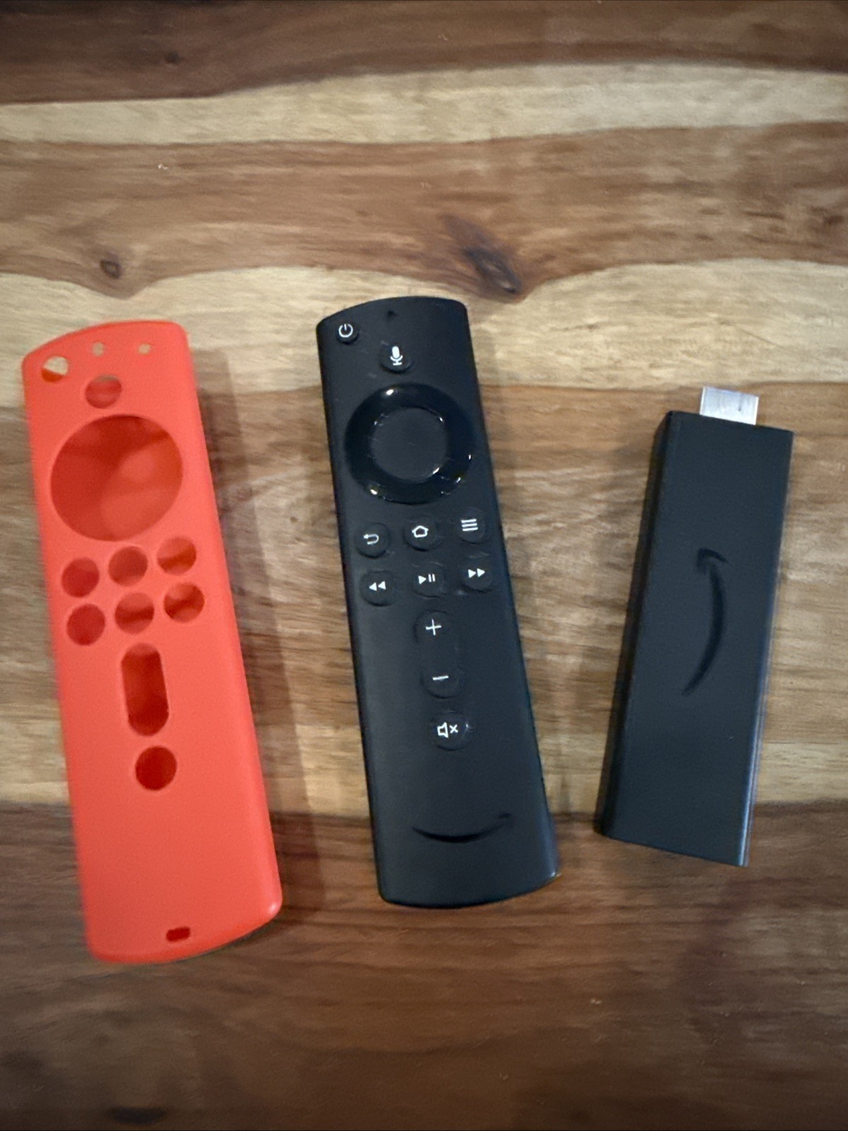 Amazon Fire TV Stick, Voice Remote Black (E9L29Y), & Red Remote Cover.